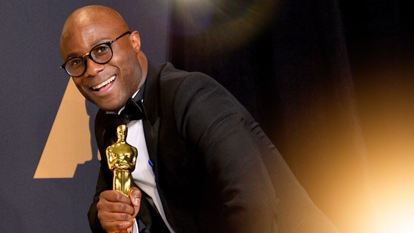 Barry Jenkins holding an Academy Award