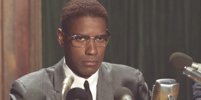 Malcolm X delivering a speech.