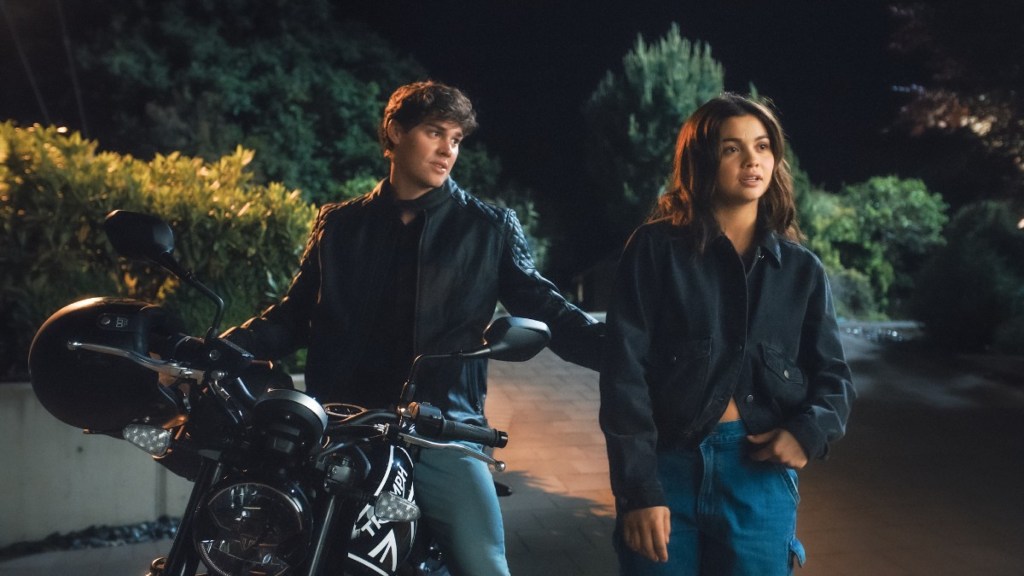 Drayton on a motorbike talking to Dallas.