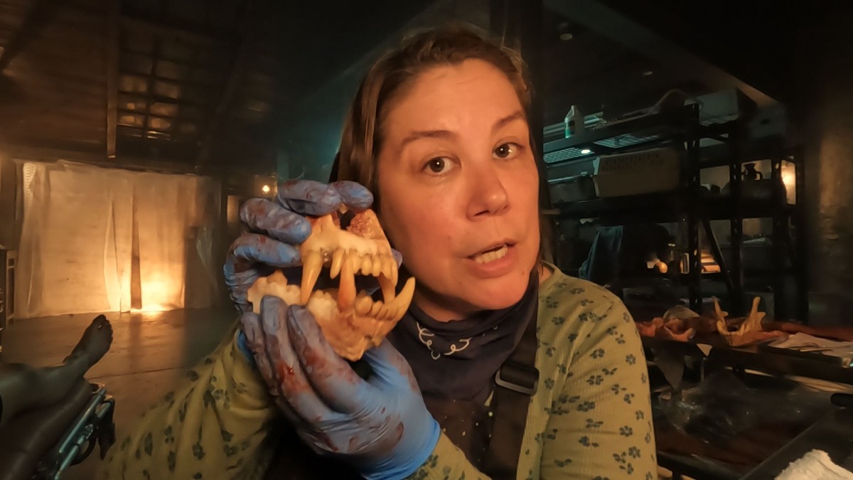 Becky with a dog's jaw in V/H/S/99.