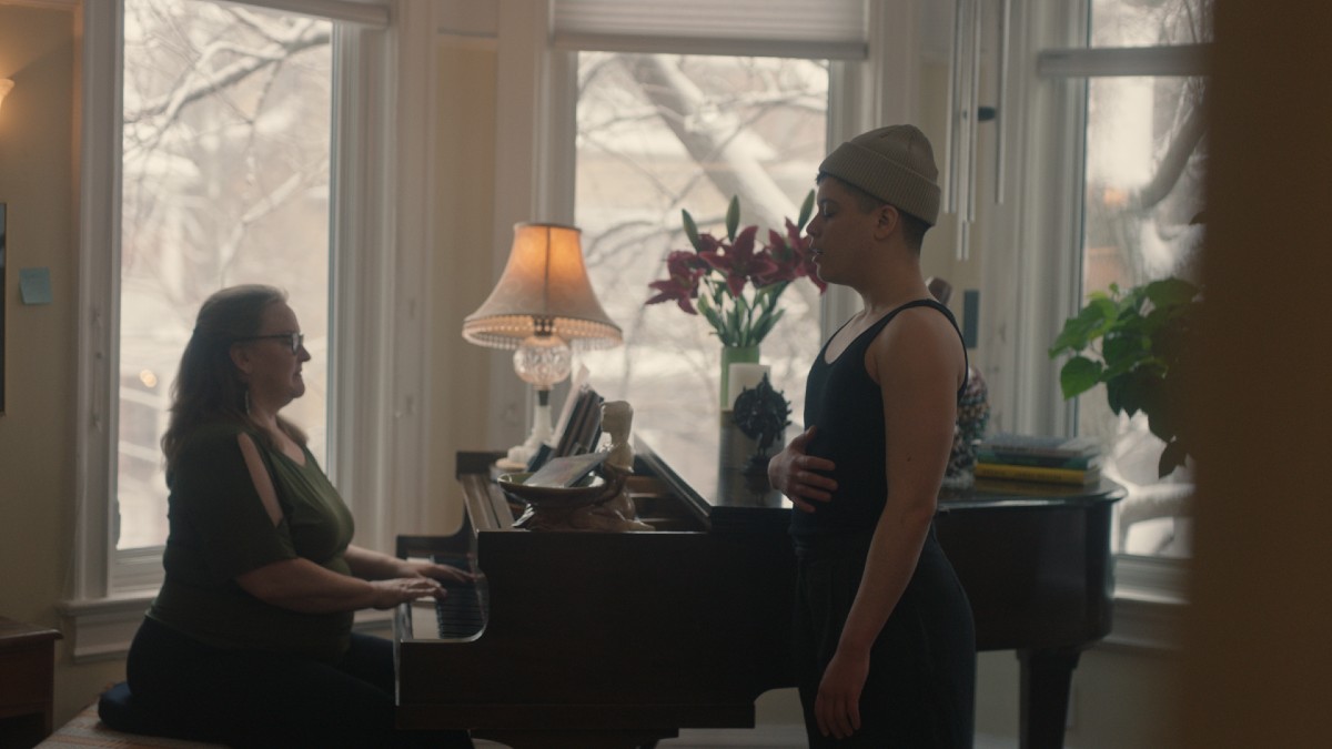 Z singing alongside his vocal coach in Really Happy Someday.