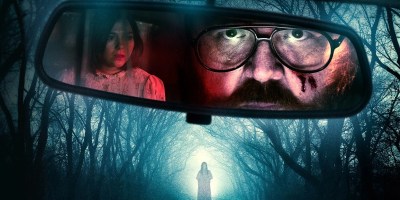 Nick Frost looking in a rear view mirror in Black Cab.