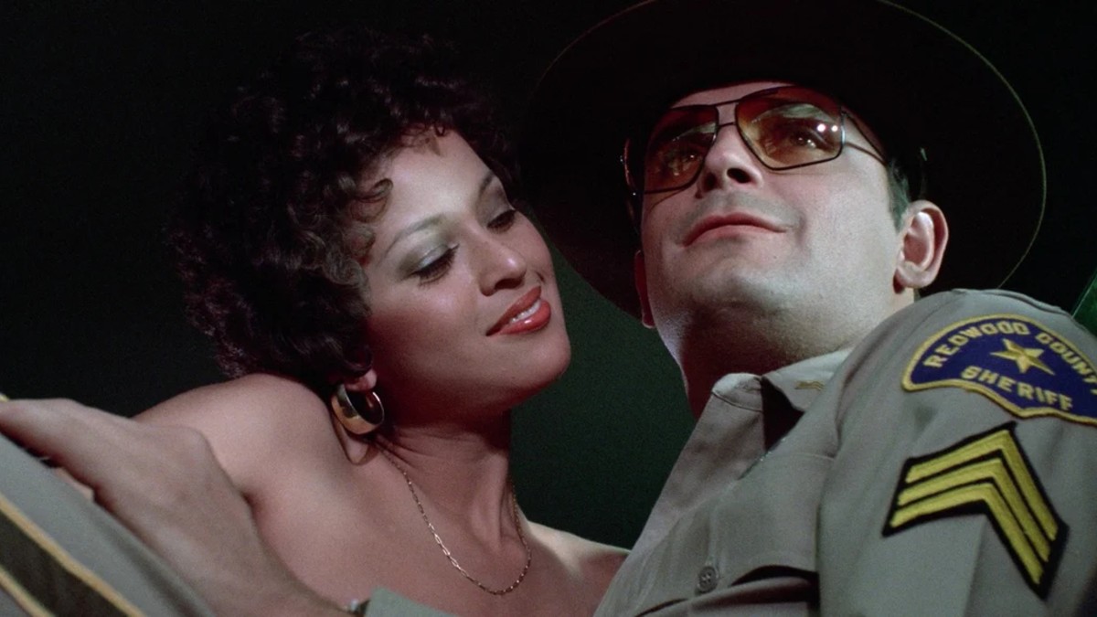 The sheriff being seduced by a woman in Up!