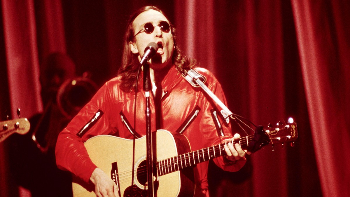 John Lennon playing the guitar in Borrowed Time: Lennon's Last Decade.