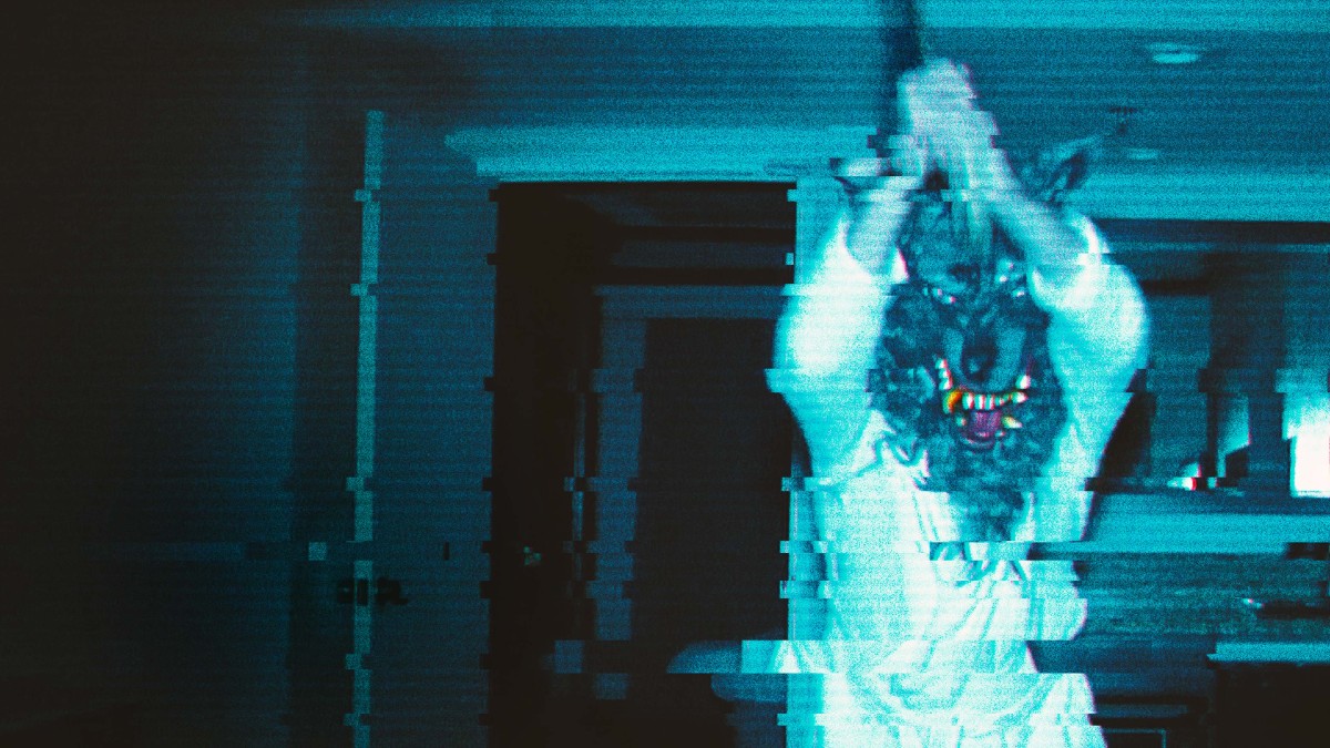 Mark Duplass' character wearing a wolf mask and swinging an axe in The Creep Tapes.