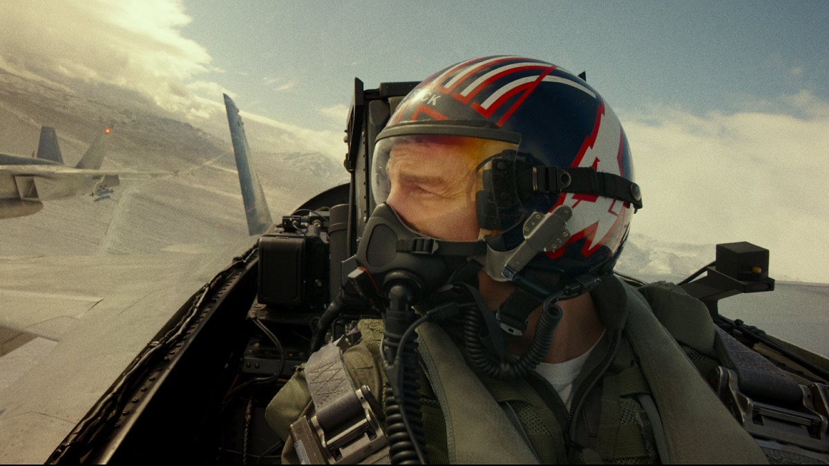 Tom Cruise flying a jet in Top Gun: Maverick.