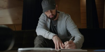Eminem writing lyrics in the Stans documentary.