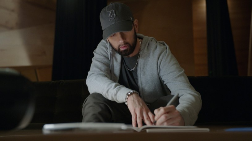 Eminem writing lyrics in the Stans documentary.