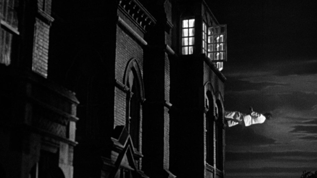 Stratton descending a building in The Man in the White Suit.