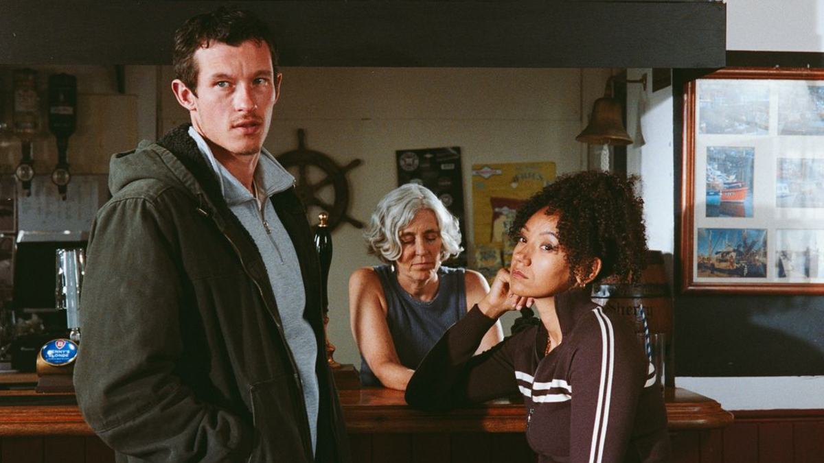Callum Turner with two women in Rose of Nevada.